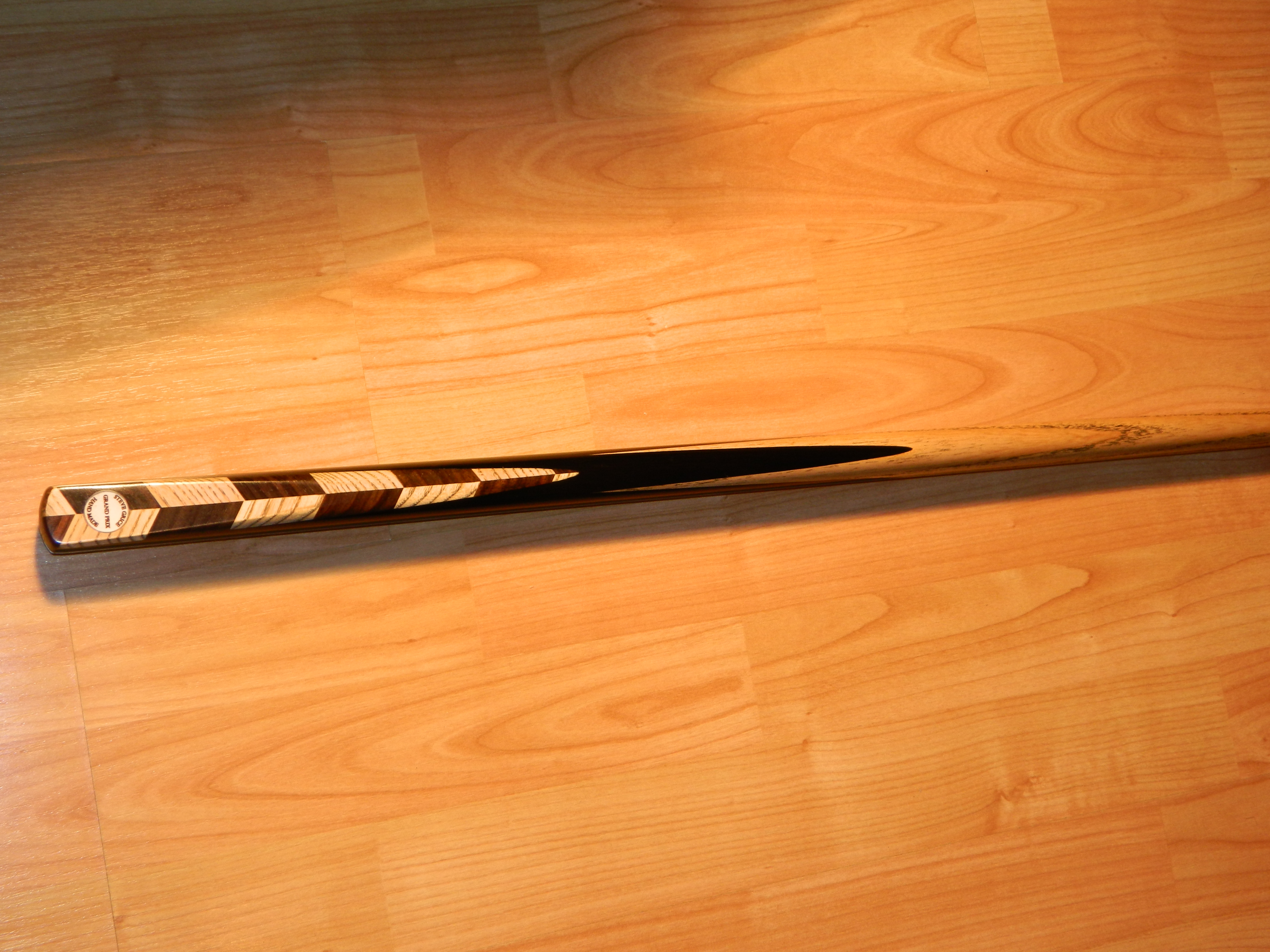 Steve Grice Grand Prix cue, an African ebony hand spliced butt with parquetry wedge of contra stacked rosewood and ash.